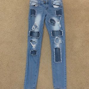 Ripped and patched blue jeans